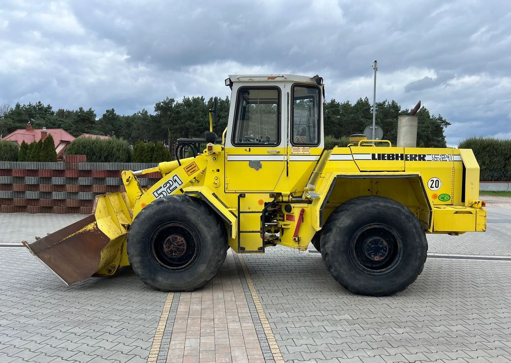 Liebherr L 521 - Gumikerekes homlokrakodó: 5 kép. Liebherr L 521 - Gumikerekes homlokrakodó: 5 kép.