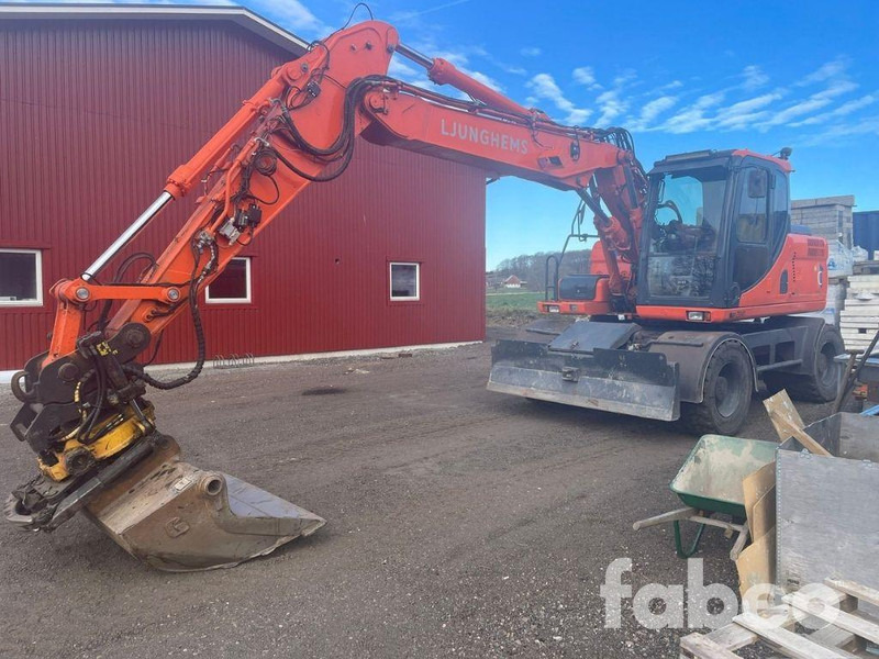 Doosan DX160W - Gumikerekes kotró: 1 kép. Doosan DX160W - Gumikerekes kotró: 1 kép.
