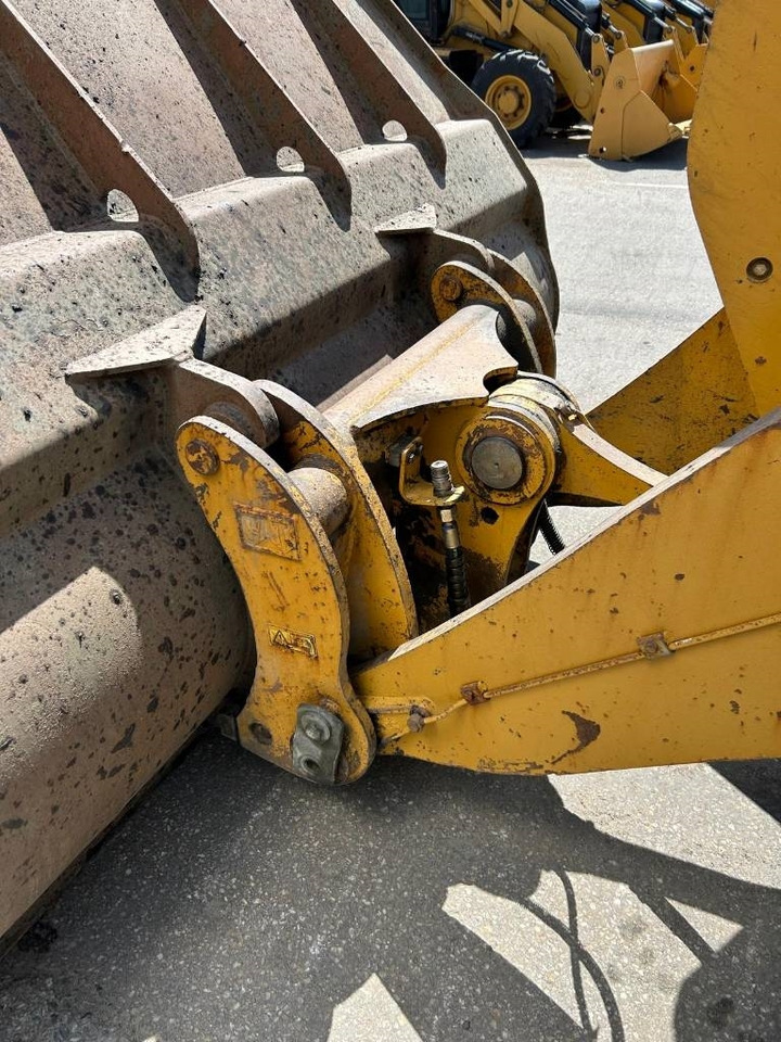 Gumikerekes homlokrakodó CAT 950 K: 23 kép.