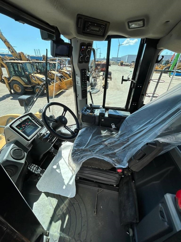 Gumikerekes homlokrakodó CAT 950 K: 11 kép.