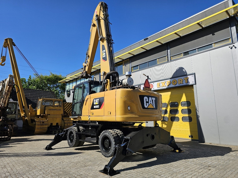 Caterpillar MH 3022 - Gumikerekes kotró: 3 kép. Caterpillar MH 3022 - Gumikerekes kotró: 3 kép.