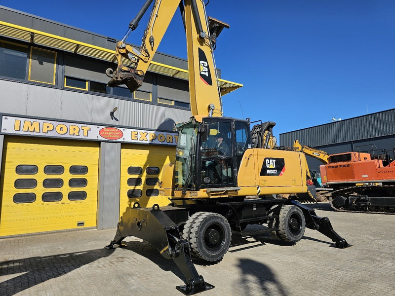 Caterpillar MH 3022 - Gumikerekes kotró: 2 kép. Caterpillar MH 3022 - Gumikerekes kotró: 2 kép.