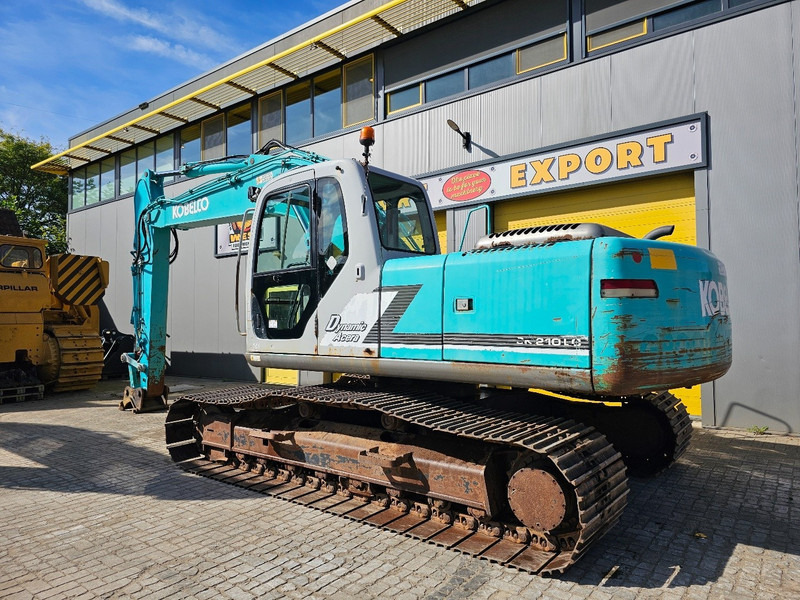 Kobelco SK210LC-6 - Lánctalpas kotró: 3 kép. Kobelco SK210LC-6 - Lánctalpas kotró: 3 kép.