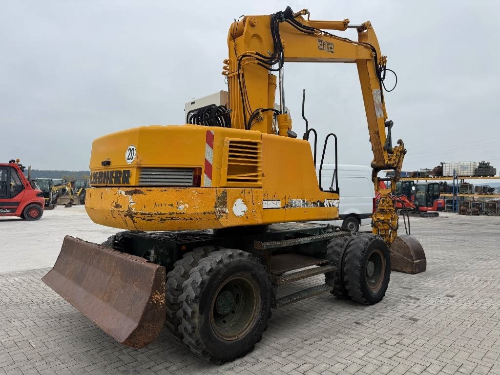 Liebherr A 312  - Gumikerekes kotró: 5 kép. Liebherr A 312  - Gumikerekes kotró: 5 kép.
