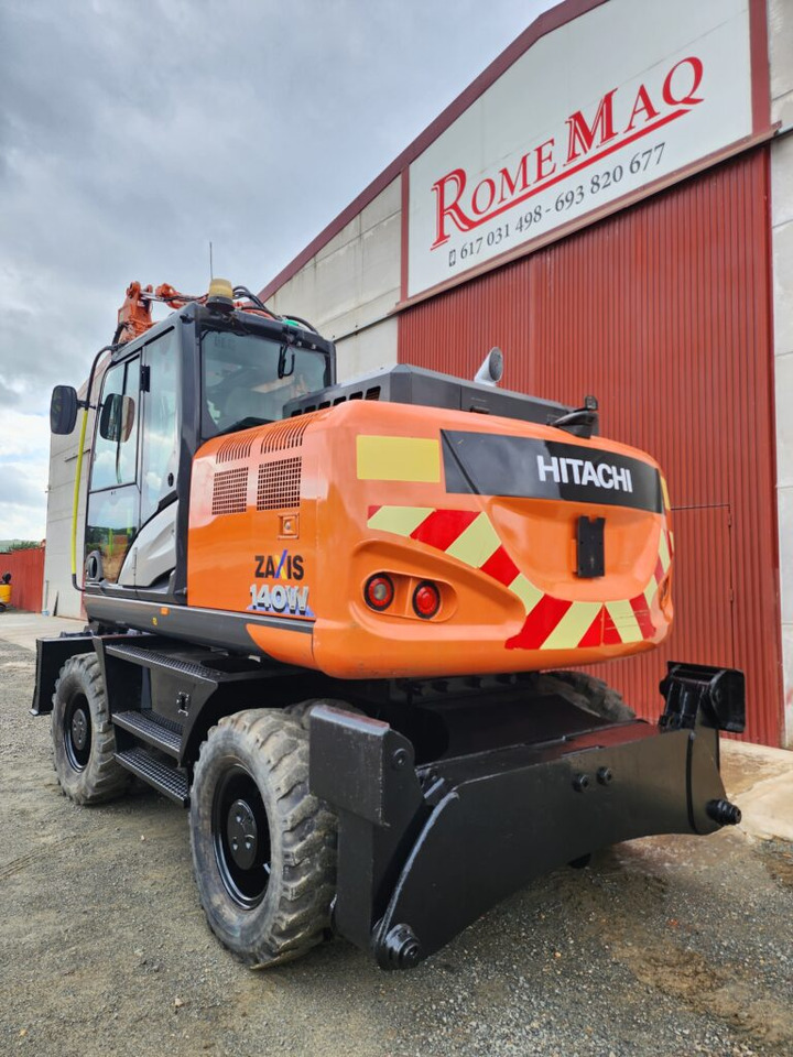 HITACHI ZX140W-6 - Gumikerekes kotró: 2 kép. HITACHI ZX140W-6 - Gumikerekes kotró: 2 kép.