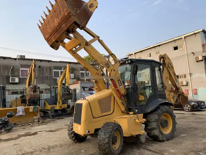 High Quality Original Uk JCB 3CX excavator used wheel loaders 7 ton backhoe loader with good working condition in stock for sale - Kotrórakodó: 3 kép. High Quality Original Uk JCB 3CX excavator used wheel loaders 7 ton backhoe loader with good working condition in stock for sale - Kotrórakodó: 3 kép.