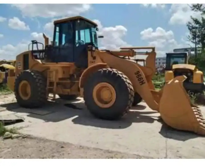 Used Construction Caterpillar 966h Wheeled Loader Cat966h Cat966 Wheel Loader in Shanghai - Gumikerekes homlokrakodó: 5 kép. Used Construction Caterpillar 966h Wheeled Loader Cat966h Cat966 Wheel Loader in Shanghai - Gumikerekes homlokrakodó: 5 kép.