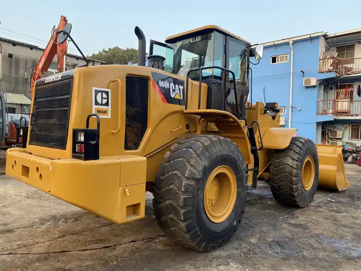 Second hand construction machinery used cat wheel loader used CAT 966H second hand wheel loader - Gumikerekes homlokrakodó: 3 kép. Second hand construction machinery used cat wheel loader used CAT 966H second hand wheel loader - Gumikerekes homlokrakodó: 3 kép.