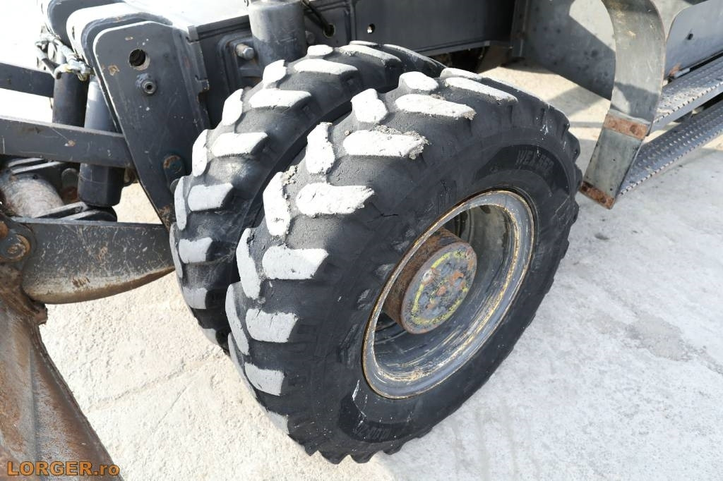 Gumikerekes kotró New Holland MH 6.6 + Sandvic Hammer: 11 kép.