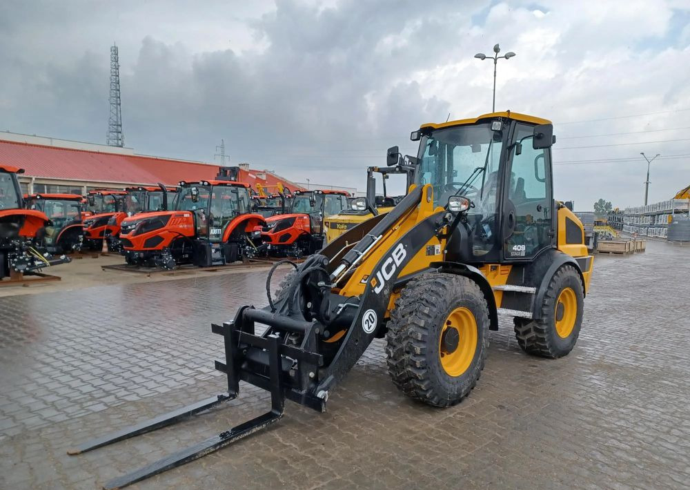 JCB 409 - Gumikerekes homlokrakodó: 2 kép. JCB 409 - Gumikerekes homlokrakodó: 2 kép.