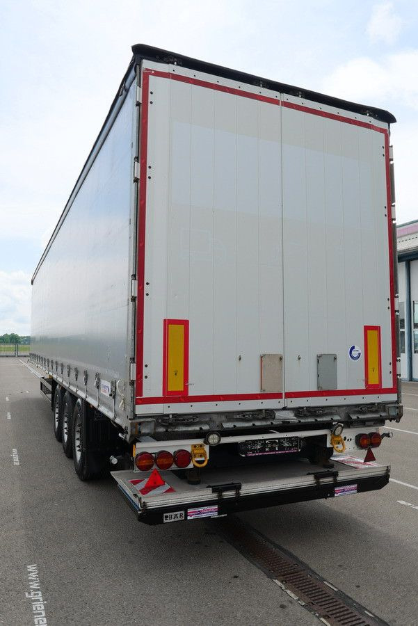 Schmitz Cargobull SCS 24/ LBW 2000 kg / RUNGENTASCHEN / HUBDACH - Ponyvás félpótkocsi: 2 kép. Schmitz Cargobull SCS 24/ LBW 2000 kg / RUNGENTASCHEN / HUBDACH - Ponyvás félpótkocsi: 2 kép.
