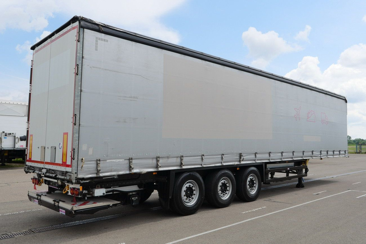 Schmitz Cargobull SCS 24/ LBW 2000 kg / RUNGENTASCHEN / HUBDACH - Ponyvás félpótkocsi: 5 kép. Schmitz Cargobull SCS 24/ LBW 2000 kg / RUNGENTASCHEN / HUBDACH - Ponyvás félpótkocsi: 5 kép.