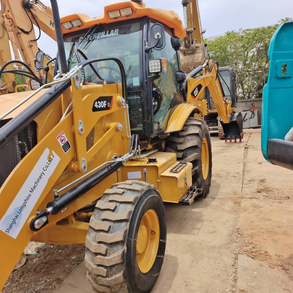 CAT 430 F 100% New - Kotrórakodó: 3 kép. CAT 430 F 100% New - Kotrórakodó: 3 kép.