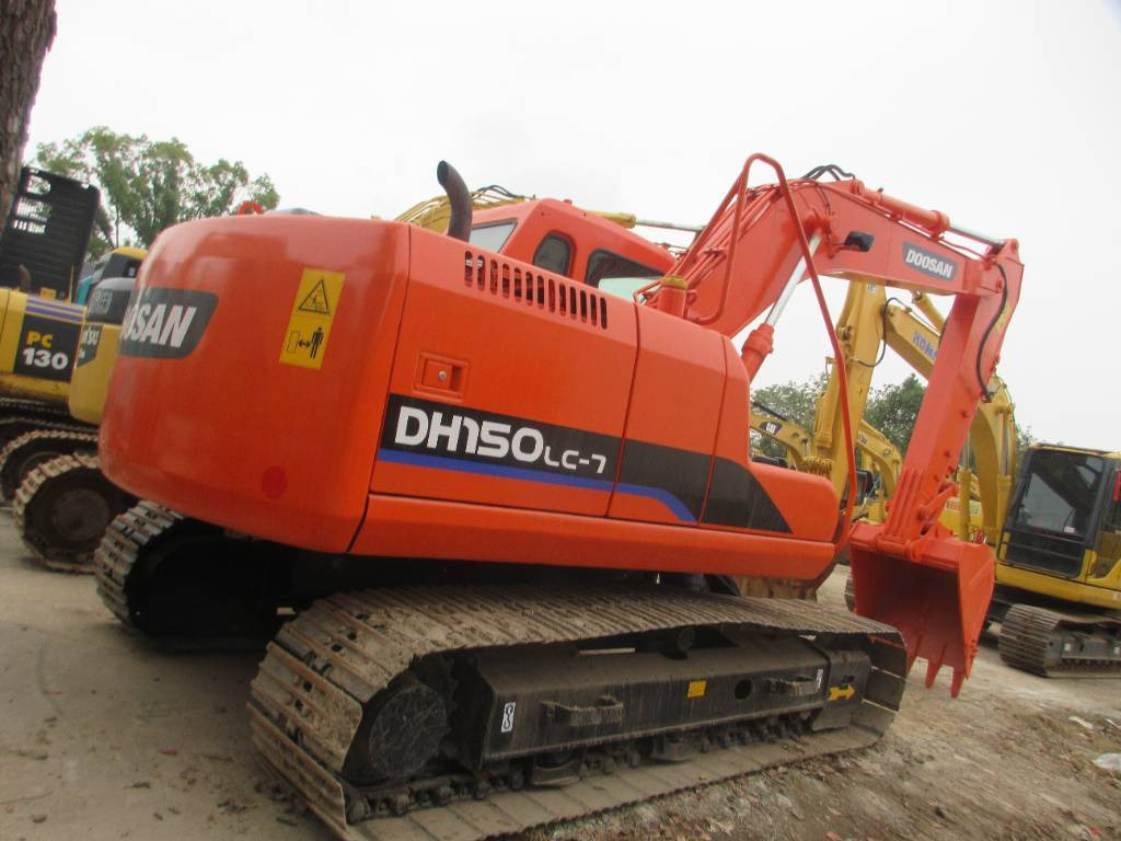 Doosan DH 150 LC-7 - Gumikerekes kotró: 1 kép. Doosan DH 150 LC-7 - Gumikerekes kotró: 1 kép.