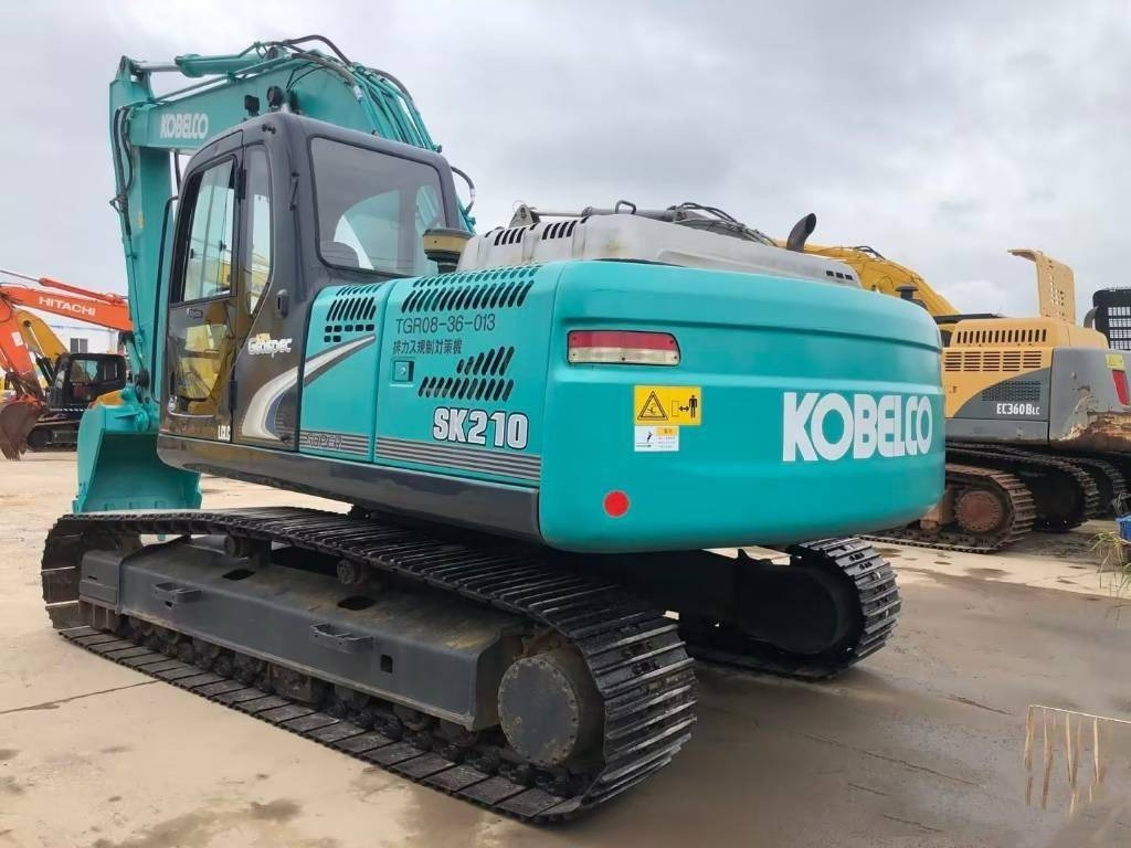 Kobelco SK 210 - Lánctalpas kotró: 1 kép. Kobelco SK 210 - Lánctalpas kotró: 1 kép.