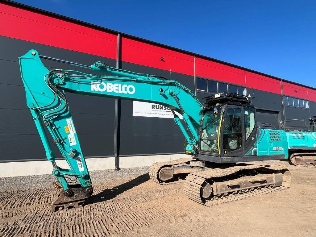 Kobelco SK 210 LC-10E - Lánctalpas kotró: 1 kép. Kobelco SK 210 LC-10E - Lánctalpas kotró: 1 kép.