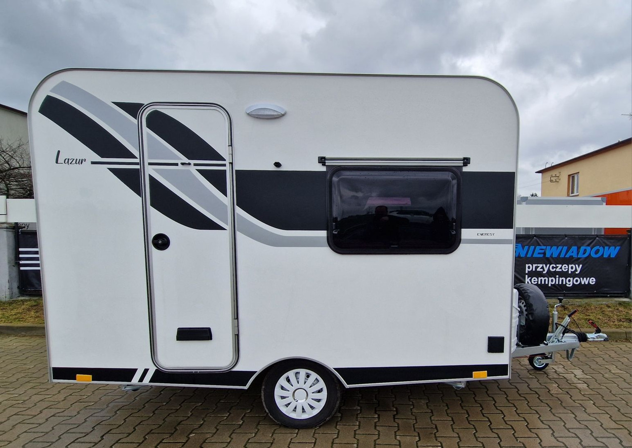 NTL-LAZUR Niewiadów z roku 2025. Przyczepa kempingowa dla 3 osób - Lakókocsi: 4 kép. NTL-LAZUR Niewiadów z roku 2025. Przyczepa kempingowa dla 3 osób - Lakókocsi: 4 kép.