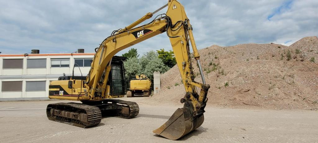 Caterpillar 318BL - Lánctalpas kotró: 2 kép. Caterpillar 318BL - Lánctalpas kotró: 2 kép.