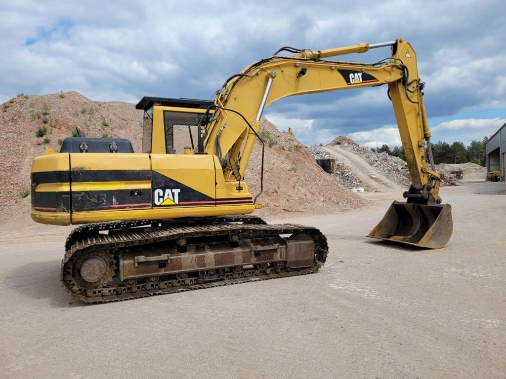 Caterpillar 318BL - Lánctalpas kotró: 4 kép. Caterpillar 318BL - Lánctalpas kotró: 4 kép.