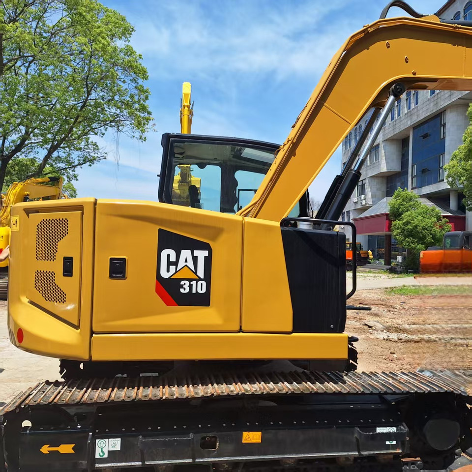 Cat 310 Excavator - Lánctalpas kotró: 1 kép. Cat 310 Excavator - Lánctalpas kotró: 1 kép.