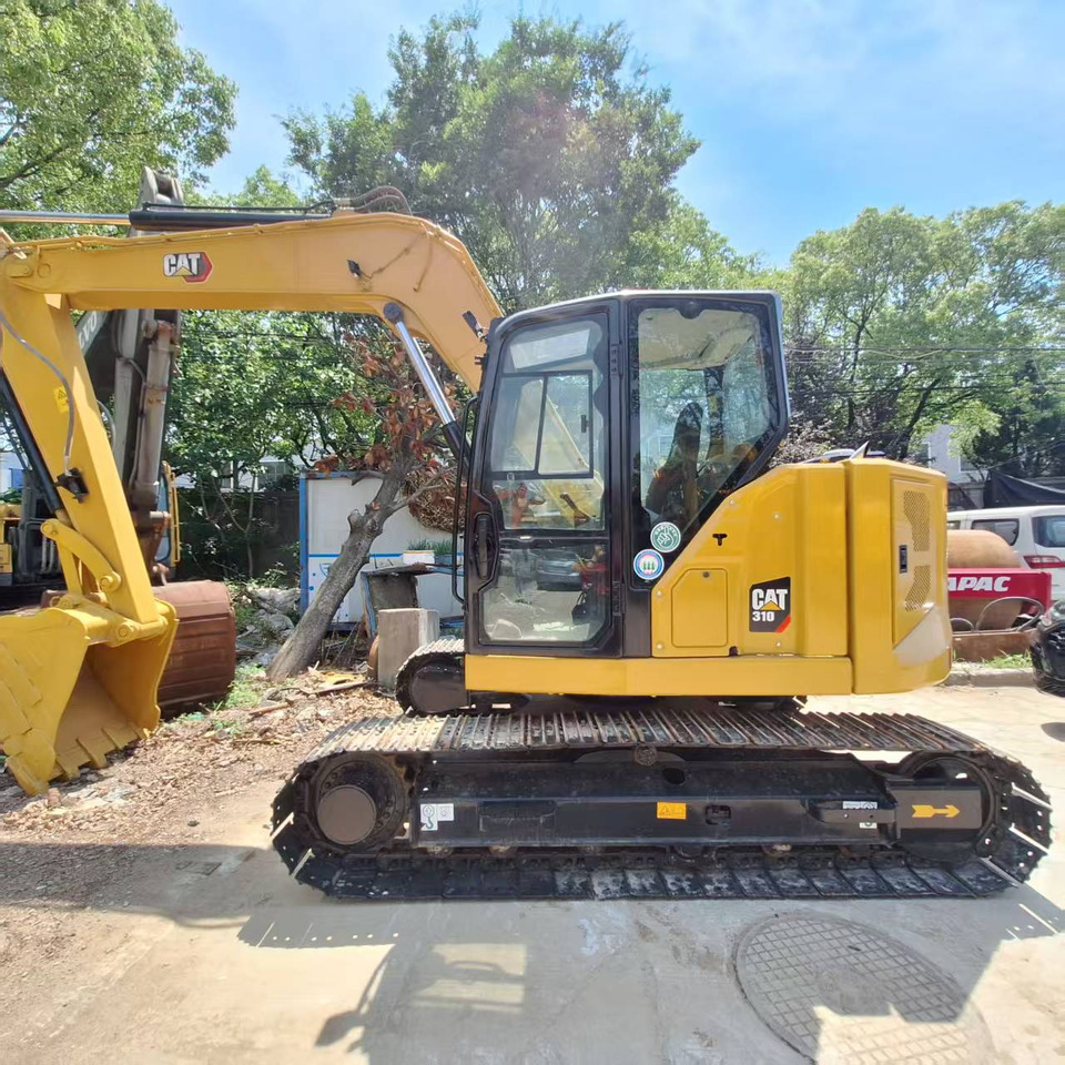 Cat 310 Excavator - Lánctalpas kotró: 4 kép. Cat 310 Excavator - Lánctalpas kotró: 4 kép.