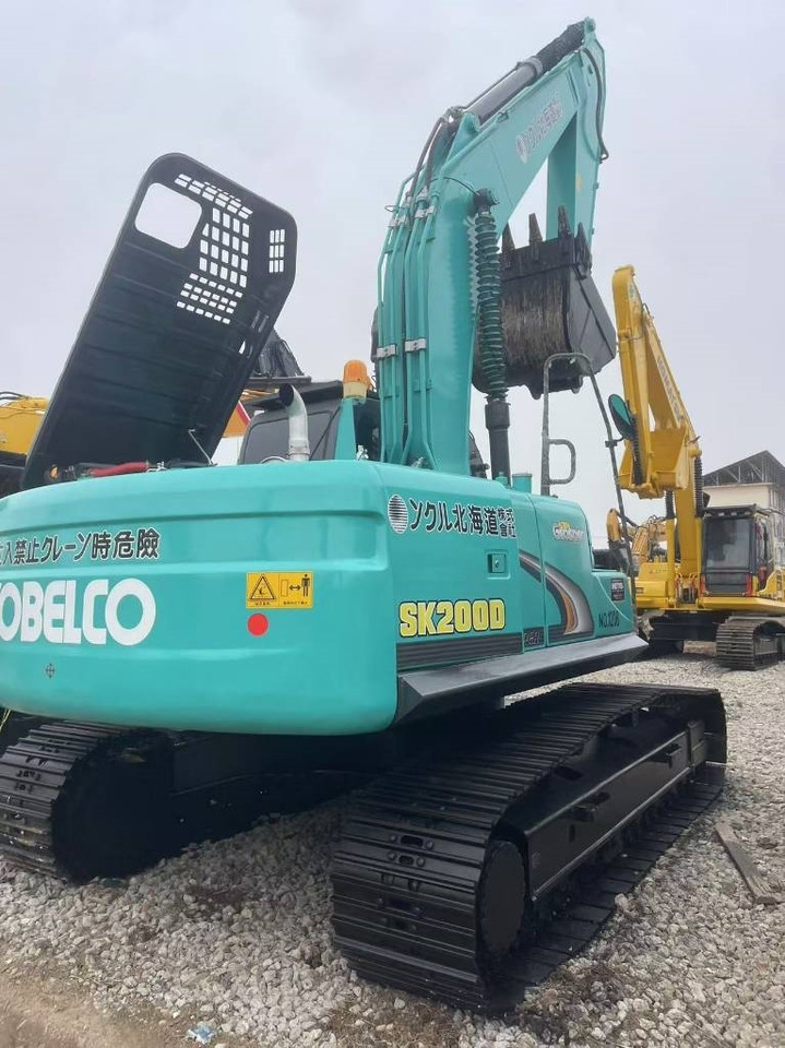 Kobelco SK 200 - Lánctalpas kotró: 1 kép. Kobelco SK 200 - Lánctalpas kotró: 1 kép.