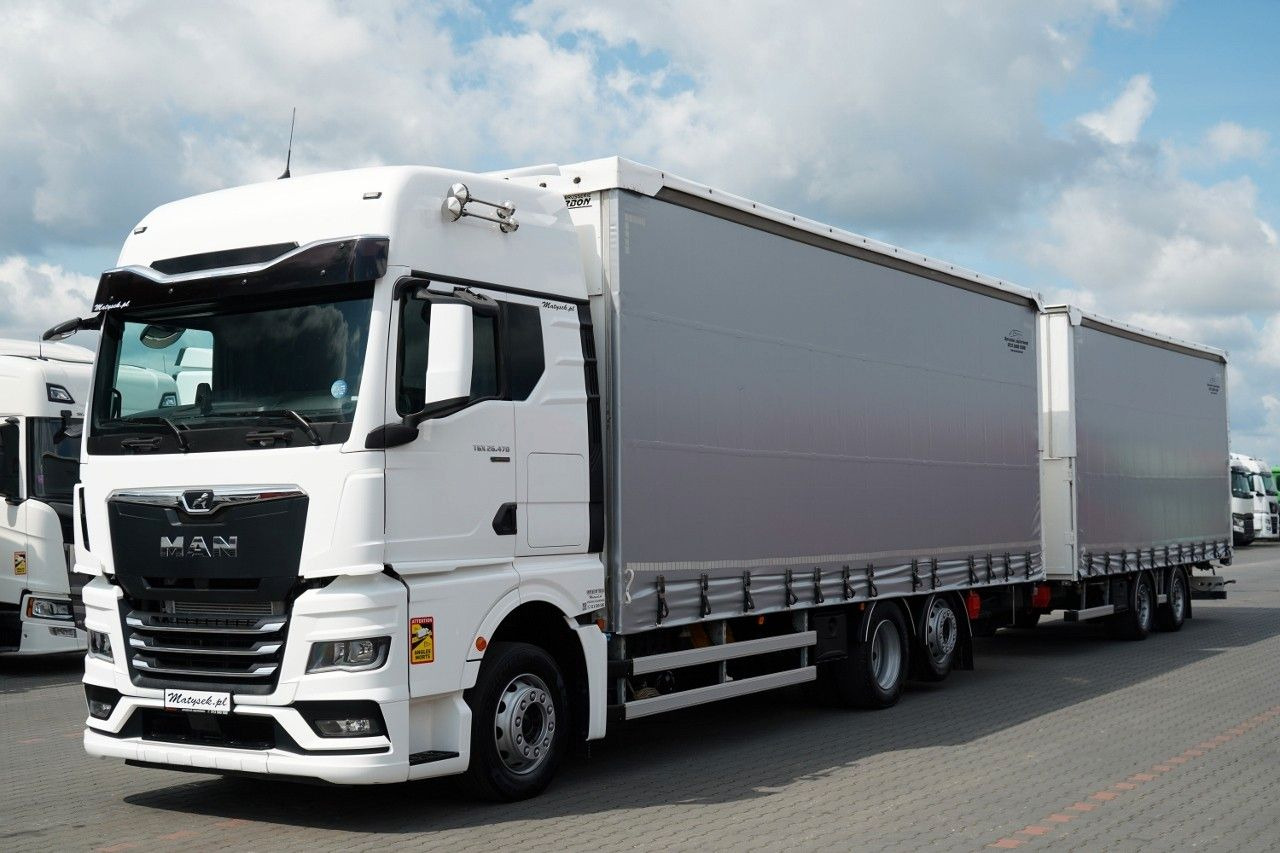 MAN TGX 26.470 / ZESTAW TANDEM 120 M3 / PRZEJAZDOWY - Ponyvás teherautó: 1 kép. MAN TGX 26.470 / ZESTAW TANDEM 120 M3 / PRZEJAZDOWY - Ponyvás teherautó: 1 kép.