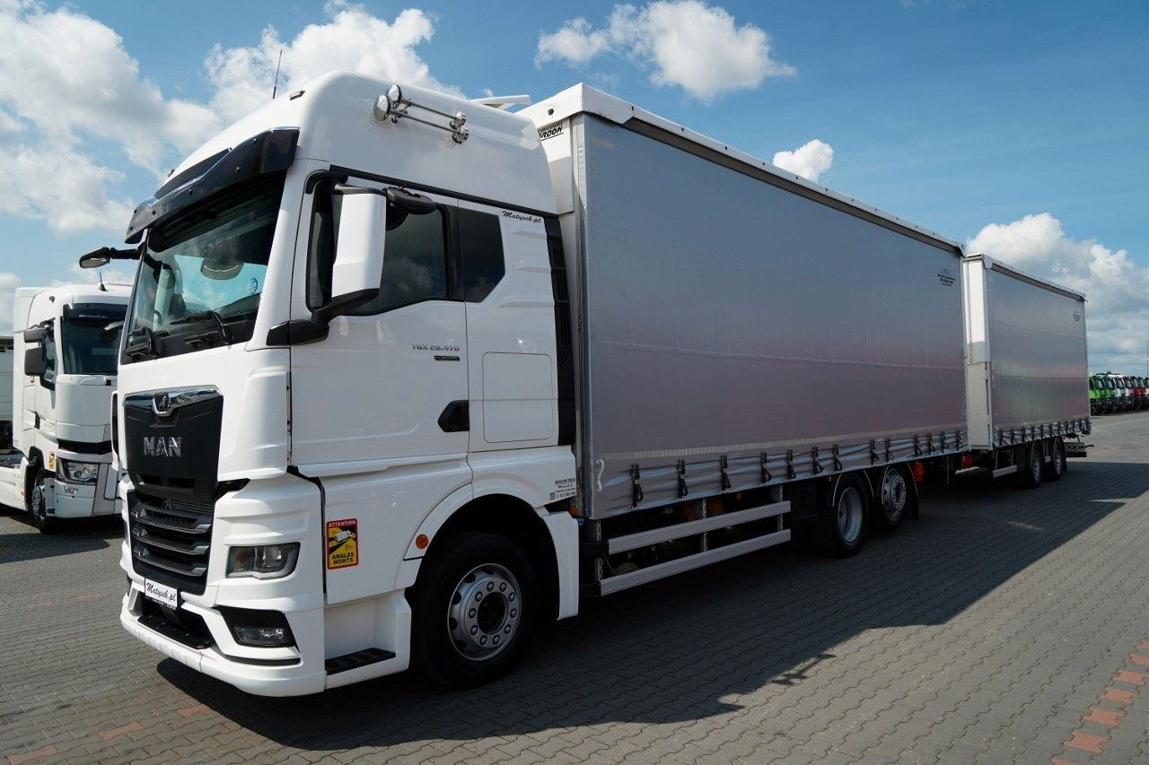 MAN TGX 26.470 / ZESTAW TANDEM 120 M3 / PRZEJAZDOWY - Ponyvás teherautó: 2 kép. MAN TGX 26.470 / ZESTAW TANDEM 120 M3 / PRZEJAZDOWY - Ponyvás teherautó: 2 kép.