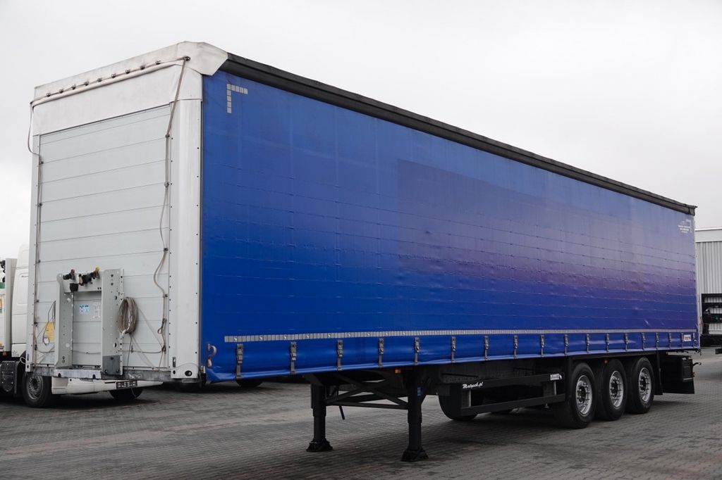 Ponyvás félpótkocsi Schmitz Cargobull FIRANKA / STANDARD / OŚ PODNOSZONA / MAŁO UŻYWAN: 1 kép.