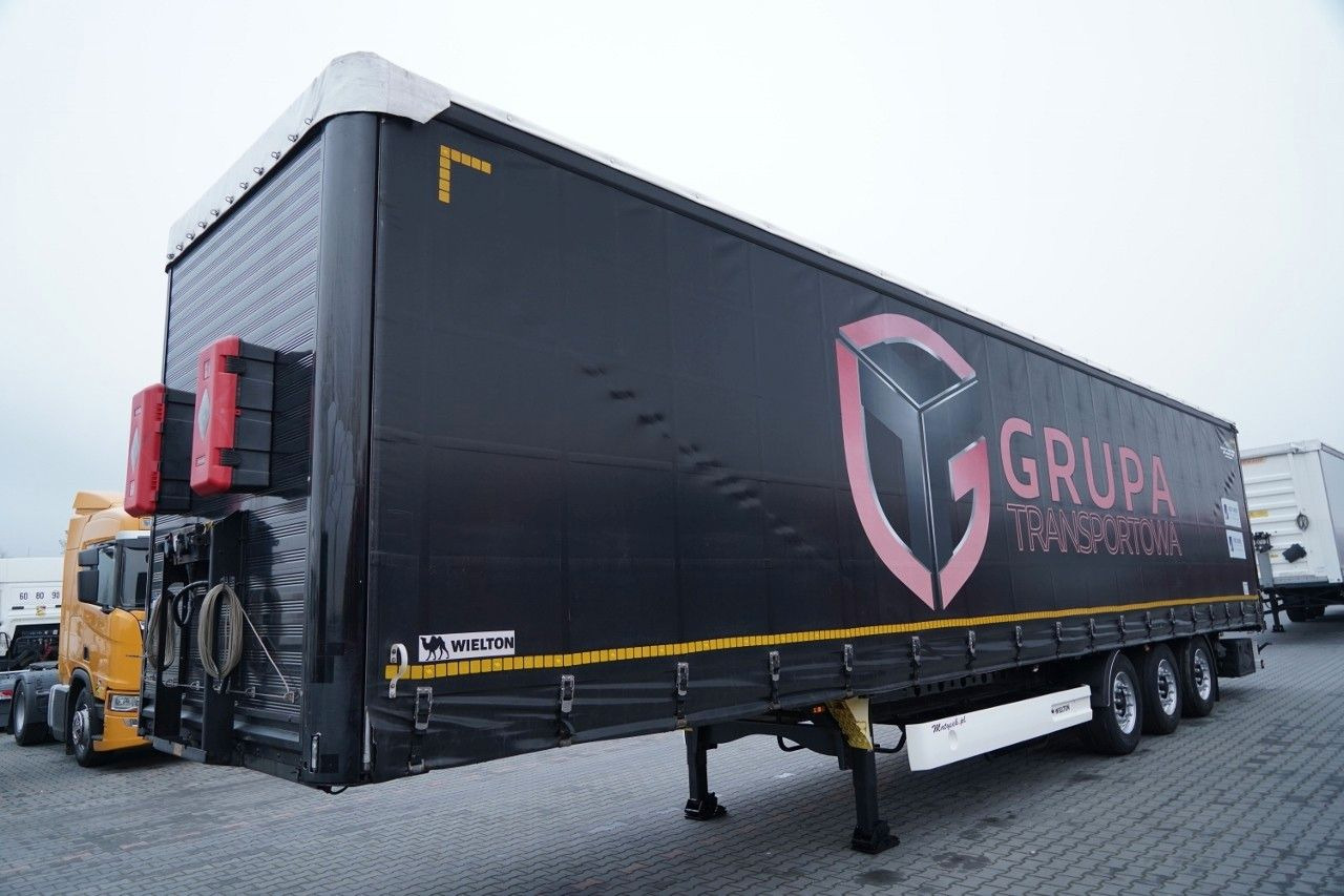 Wielton FIRANKA / VARIOS / 2x OŚ PODNOSZONA / - Ponyvás félpótkocsi: 2 kép. Wielton FIRANKA / VARIOS / 2x OŚ PODNOSZONA / - Ponyvás félpótkocsi: 2 kép.