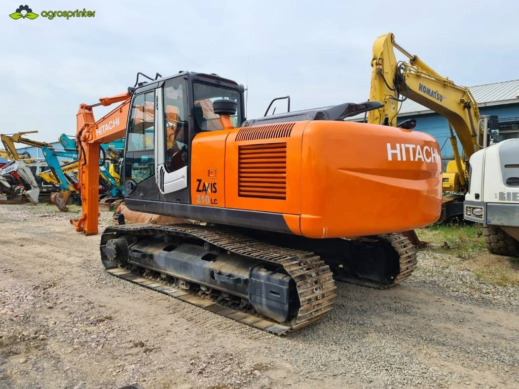 Hitachi ZX 210 H - Lánctalpas kotró: 3 kép. Hitachi ZX 210 H - Lánctalpas kotró: 3 kép.