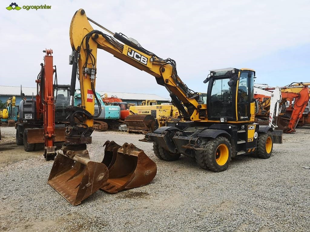 JCB Hydradig 110W - Gumikerekes kotró: 1 kép. JCB Hydradig 110W - Gumikerekes kotró: 1 kép.