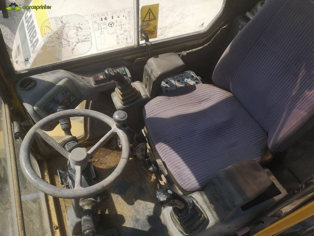 Minikotró Komatsu PW 95: 7 kép.