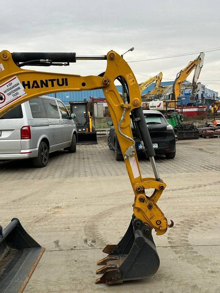 Minikotró Shantui SE17SR: 7 kép.