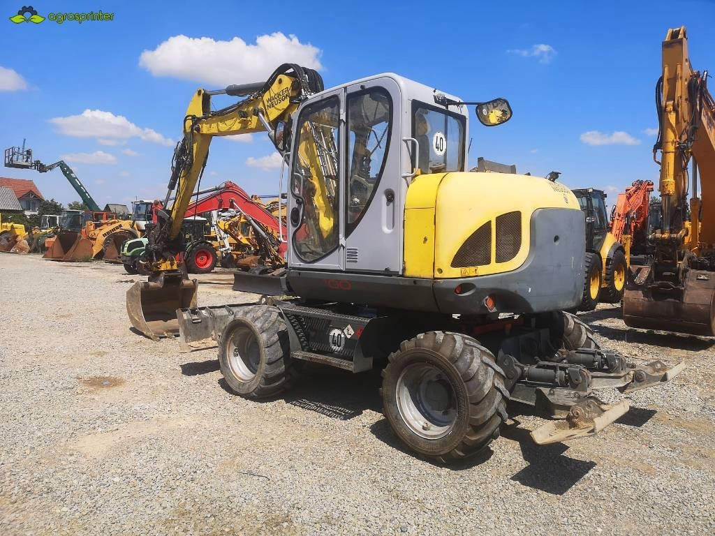 Wacker Neuson EW 100 - Gumikerekes kotró: 5 kép. Wacker Neuson EW 100 - Gumikerekes kotró: 5 kép.