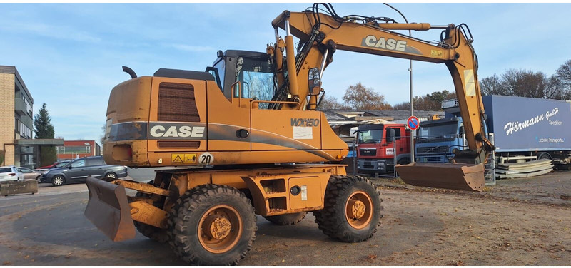 Case WX150 - Gumikerekes kotró: 4 kép. Case WX150 - Gumikerekes kotró: 4 kép.