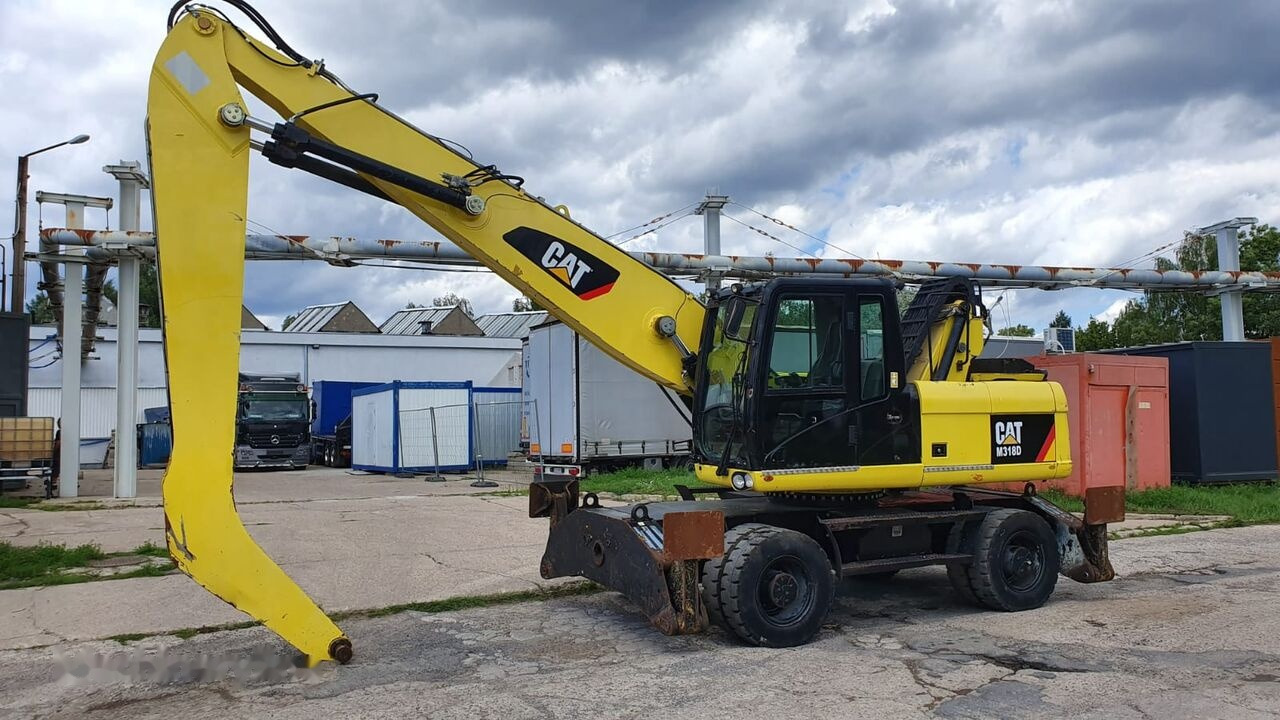 Caterpillar M 318 D MH - Hulladék kotró: 2 kép. Caterpillar M 318 D MH - Hulladék kotró: 2 kép.