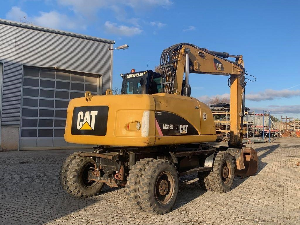 CAT M 316 D - Gumikerekes kotró: 5 kép. CAT M 316 D - Gumikerekes kotró: 5 kép.