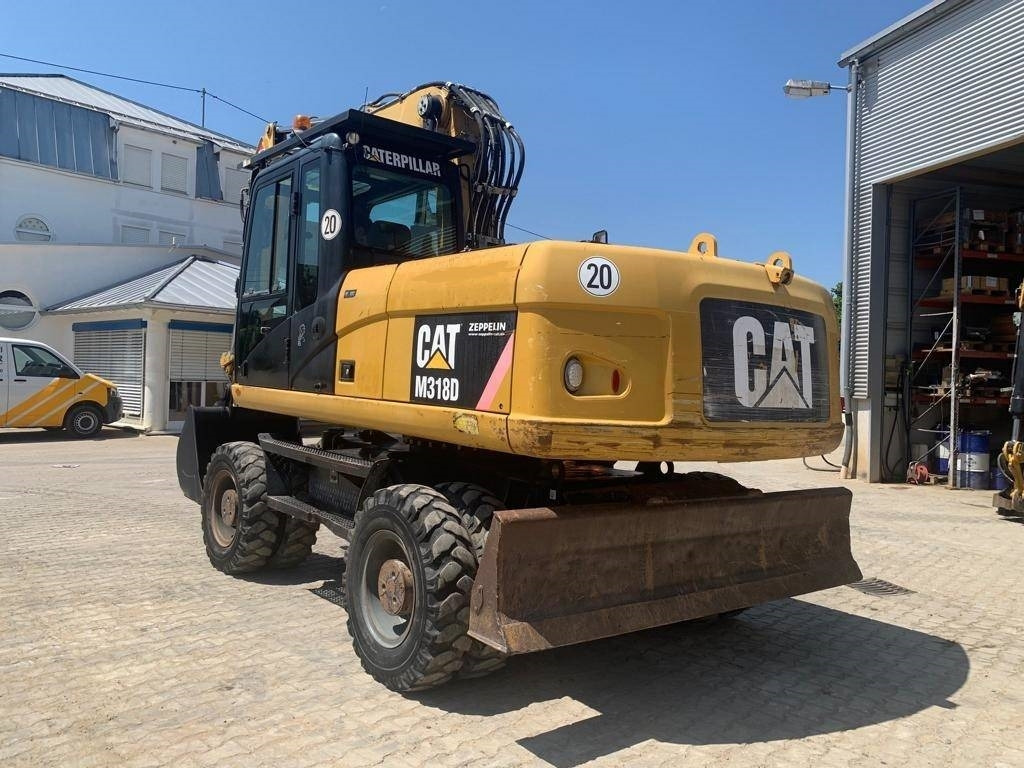 CAT M 318 D - Gumikerekes kotró: 3 kép. CAT M 318 D - Gumikerekes kotró: 3 kép.