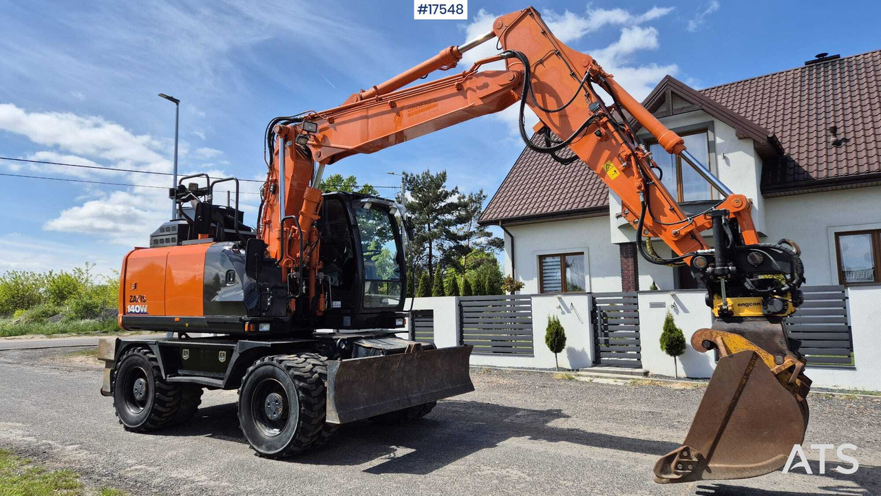 HITACHI ZX140W-6 Wheel Excavator (2019) - Gumikerekes kotró: 1 kép. HITACHI ZX140W-6 Wheel Excavator (2019) - Gumikerekes kotró: 1 kép.