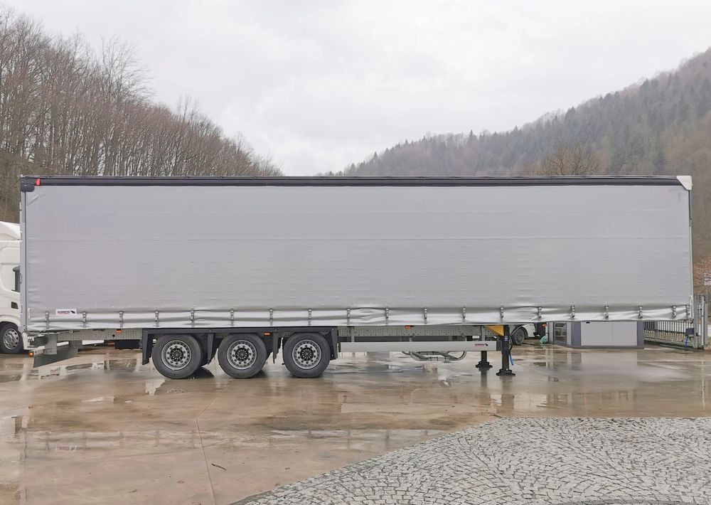 Schmitz Cargobull MEGA VARIOS - Ponyvás félpótkocsi: 4 kép. Schmitz Cargobull MEGA VARIOS - Ponyvás félpótkocsi: 4 kép.