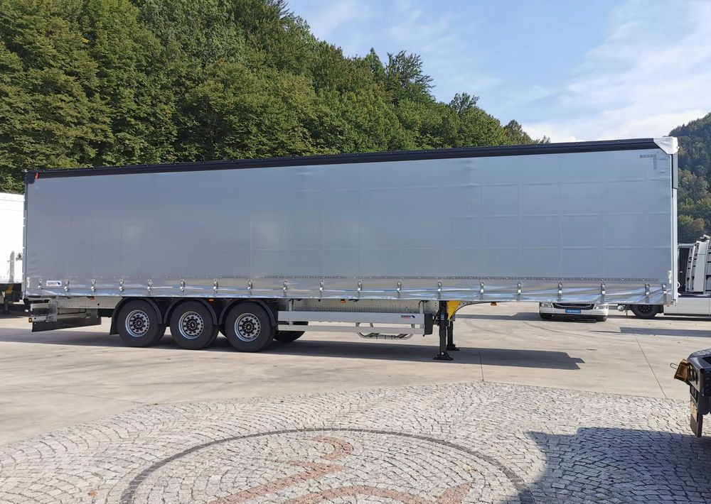 Schmitz Cargobull STANDARD + DACH VARIOS SIMPLE - Ponyvás félpótkocsi: 4 kép. Schmitz Cargobull STANDARD + DACH VARIOS SIMPLE - Ponyvás félpótkocsi: 4 kép.