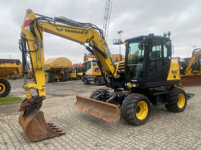 Yanmar B95w NVT - Gumikerekes kotró: 3 kép. Yanmar B95w NVT - Gumikerekes kotró: 3 kép.