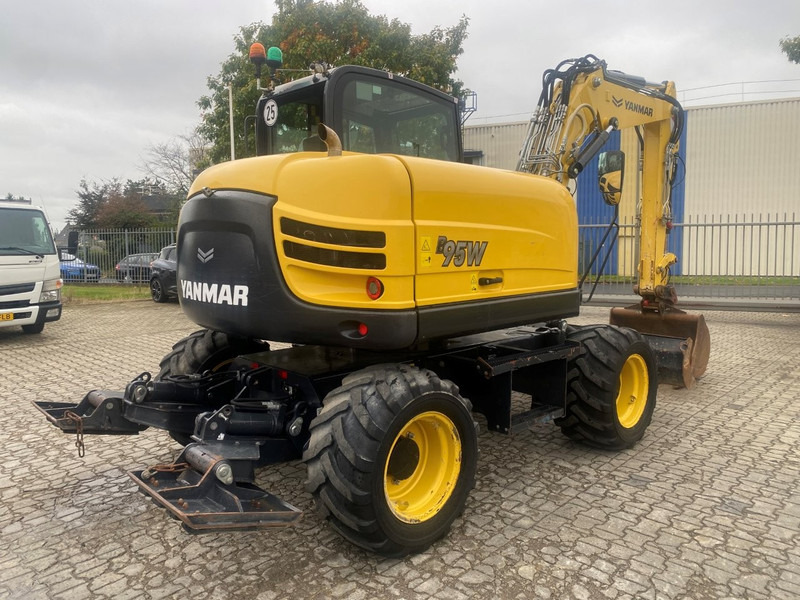 Yanmar B95w NVT - Gumikerekes kotró: 5 kép. Yanmar B95w NVT - Gumikerekes kotró: 5 kép.