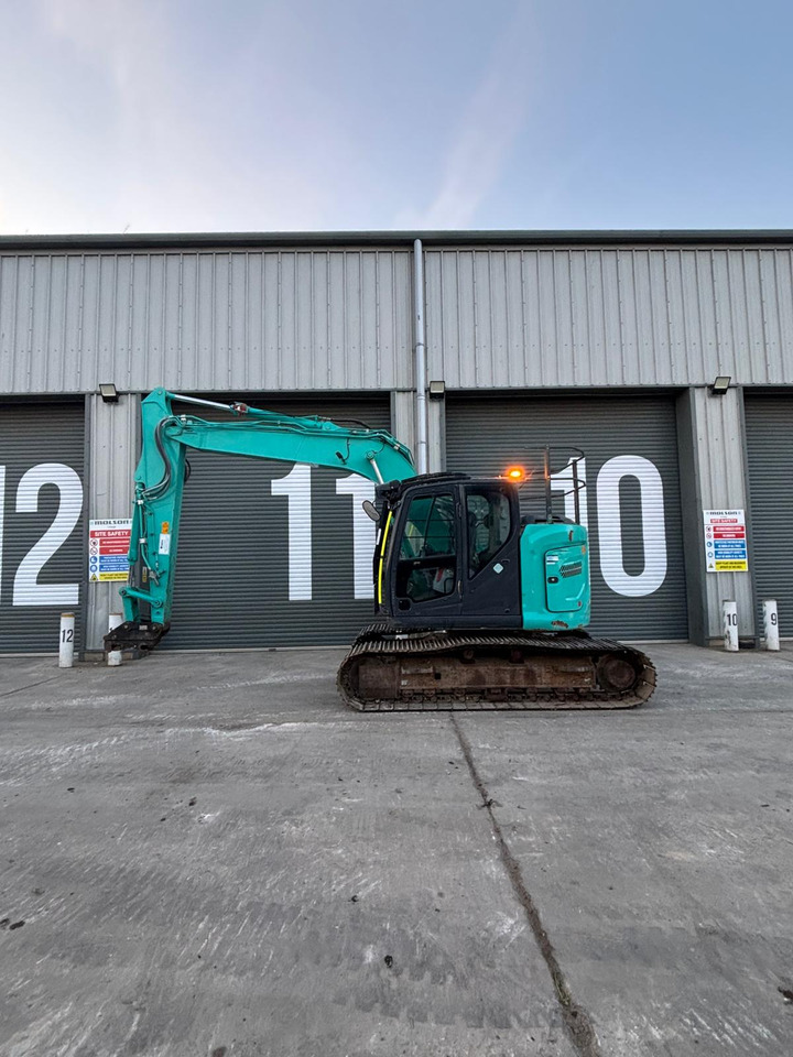 Kobelco SK140SRLC-7 - Lánctalpas kotró: 2 kép. Kobelco SK140SRLC-7 - Lánctalpas kotró: 2 kép.