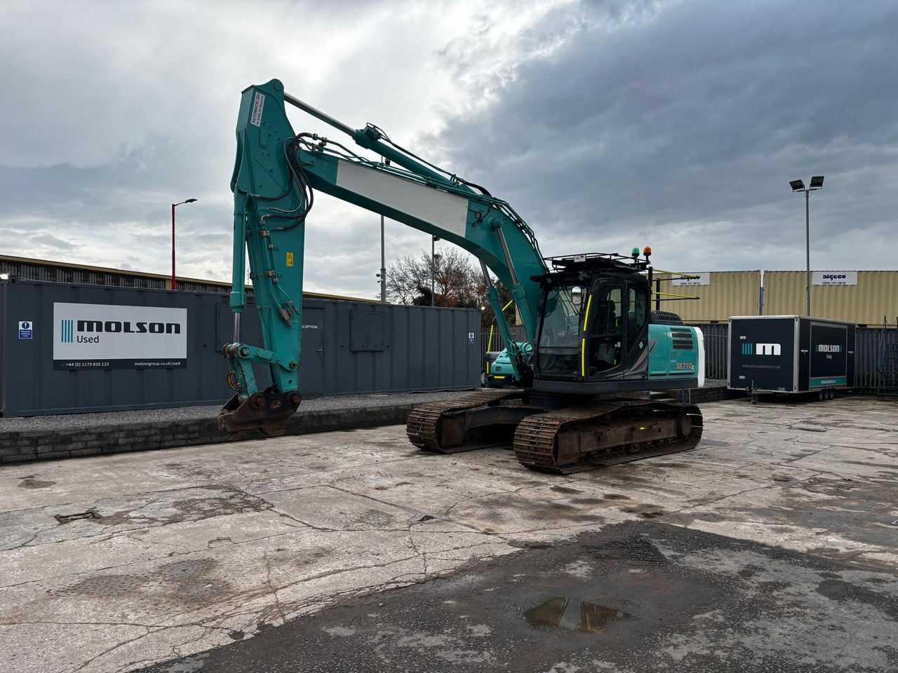 Kobelco SK210LC-11 - Lánctalpas kotró: 1 kép. Kobelco SK210LC-11 - Lánctalpas kotró: 1 kép.