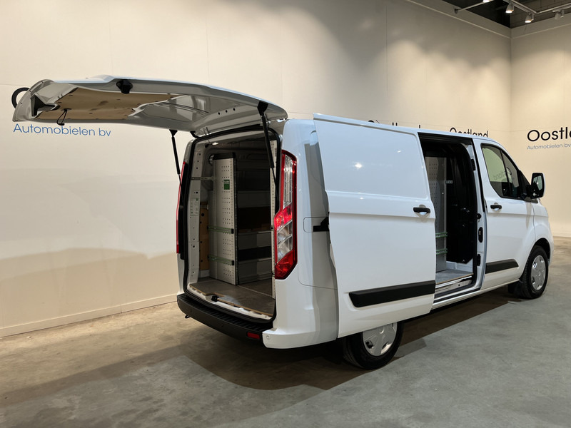 Ford Transit Custom 300 2.0 TDCI L1H1 Trend 130 PK / Servicebus / Bott Inrichting / Euro 6 / Schuifdeur L + R / Airco / CarPlay / Klep / PDC / Navigatie / 3-Zits / BPM VRIJ !! - Kis furgon: 2 kép. Ford Transit Custom 300 2.0 TDCI L1H1 Trend 130 PK / Servicebus / Bott Inrichting / Euro 6 / Schuifdeur L + R / Airco / CarPlay / Klep / PDC / Navigatie / 3-Zits / BPM VRIJ !! - Kis furgon: 2 kép.