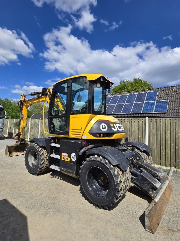 JCB 110 W Hydradig - Gumikerekes kotró: 2 kép. JCB 110 W Hydradig - Gumikerekes kotró: 2 kép.