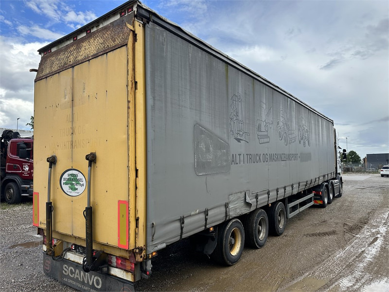 Schmitz Cargobull Machine transport trailer with bag ramp - Félpótkocsi mélybölcsős: 3 kép. Schmitz Cargobull Machine transport trailer with bag ramp - Félpótkocsi mélybölcsős: 3 kép.