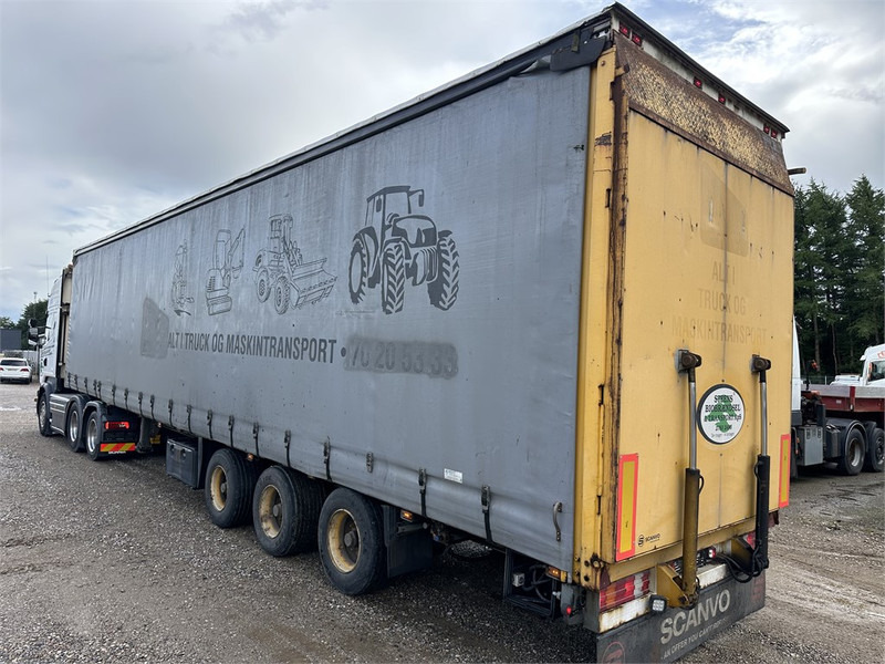 Schmitz Cargobull Machine transport trailer with bag ramp - Félpótkocsi mélybölcsős: 2 kép. Schmitz Cargobull Machine transport trailer with bag ramp - Félpótkocsi mélybölcsős: 2 kép.